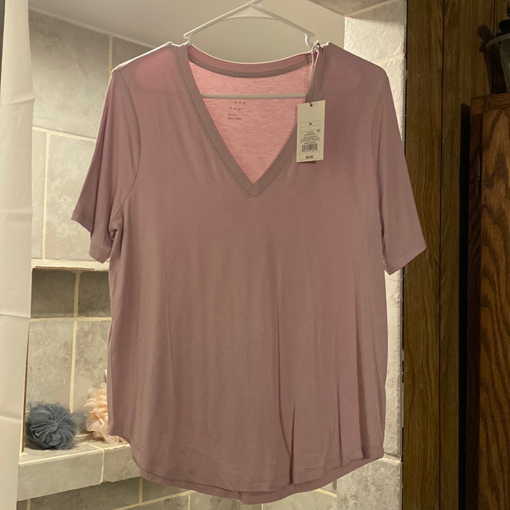 Light purple size M. Short sleeve shirt